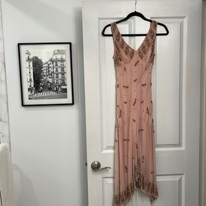 Beaded and beautiful rose colored midi dress with a vintage appeal!